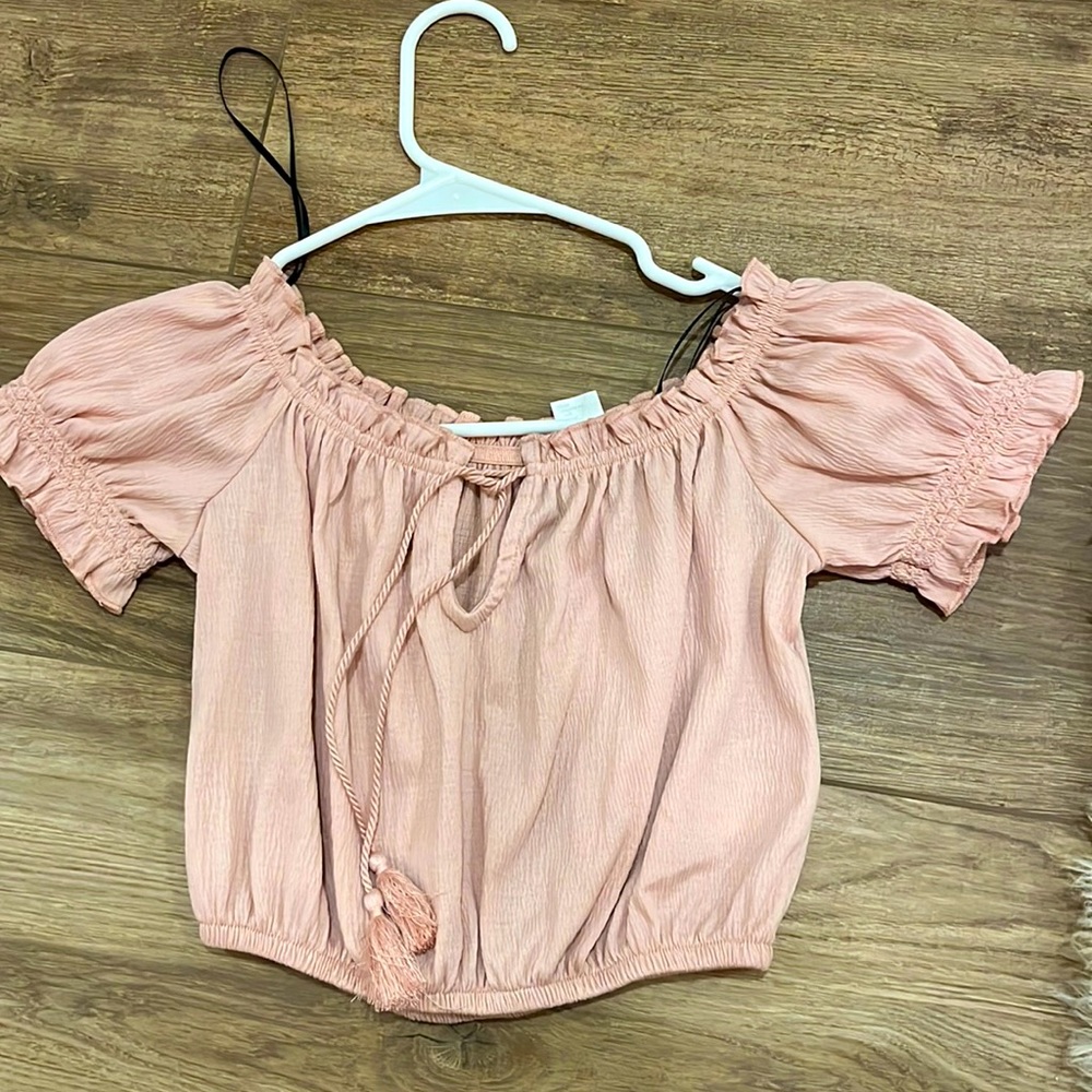 Woman’s pink top